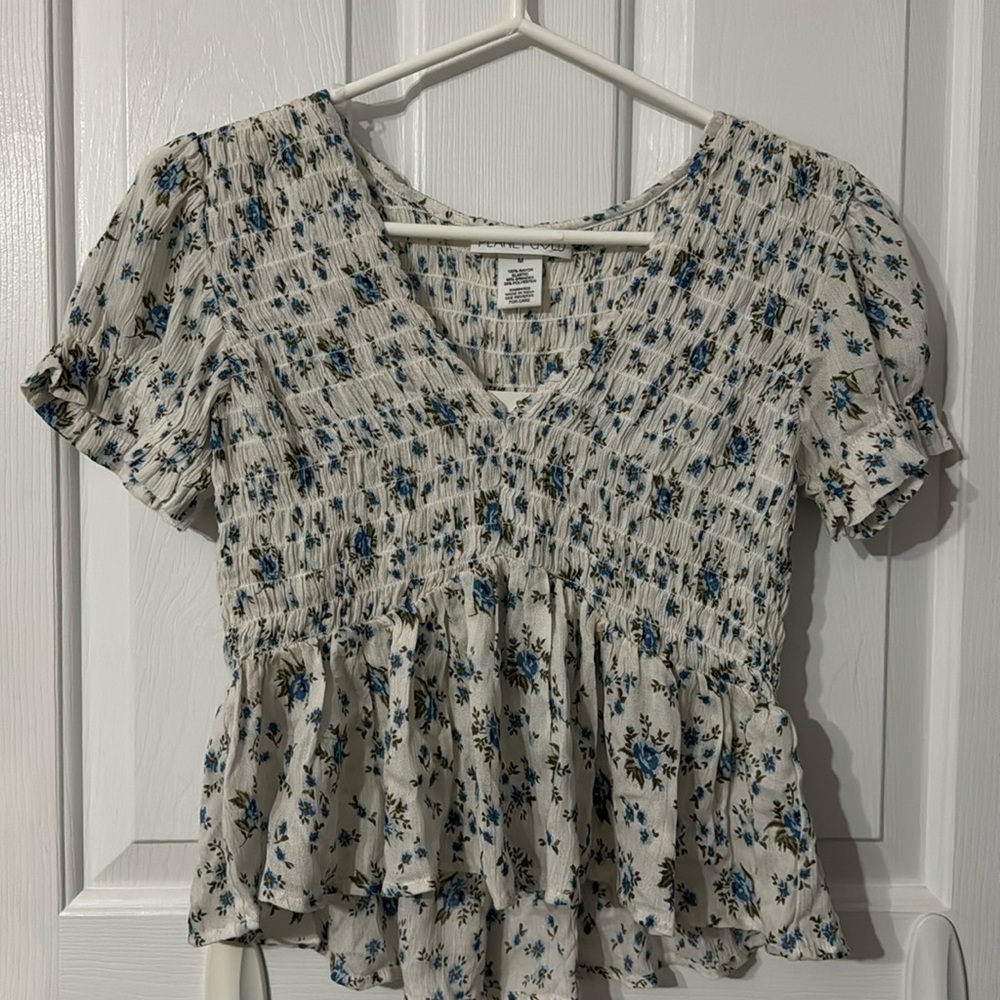Short dressy short sleeve shirt with v-neck.